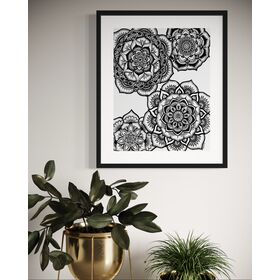 A fine art giclée print featuring four detailed black and white floral mandalas