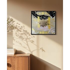 Framed abstract artwork of hands filled with the sky, an exploding gold star and geometric shapes on a tan background.