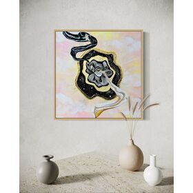 Framed artwork with a black and gold abstract swirls coming out of golden eye on a night sky over a pastel pink and yellow sky background