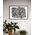 Framed black and white abstract geometric artwork with eyes, whimsical linework and botanicals on a white background
