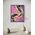 Framed artwork with abstract black and white fluid design on a pink and purple sky background with a moon and gold leaf rays