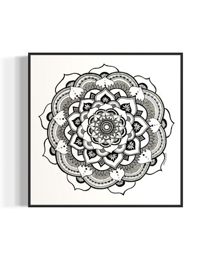 Black and white mandala art print in a black frame on a white background