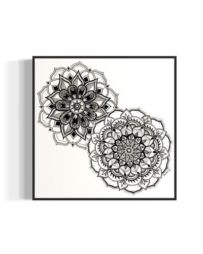 Framed artwork of two black and white mandala flower designs on a white background