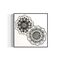 Framed artwork of two black and white mandala flower designs on a white background